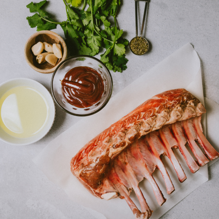 Ingredients needed for Blackstone Garlic Butter Lamb Chops on kitchen table.