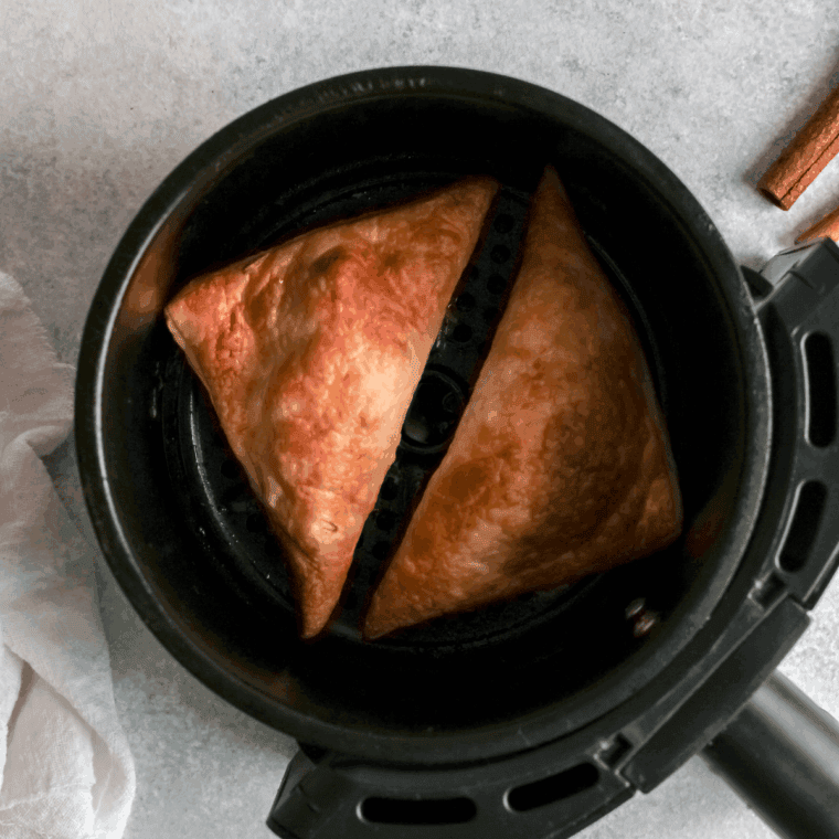 Crisp air fryer apple turnovers fresh from the basket, golden and puffed