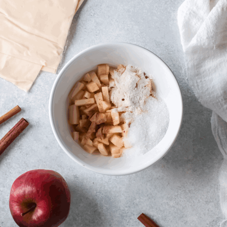 Diced apples tossed with brown sugar and cinnamon for turnover filling