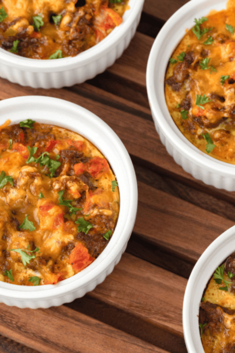 Overhead of ramekins filled with air fryer breakfast casserole