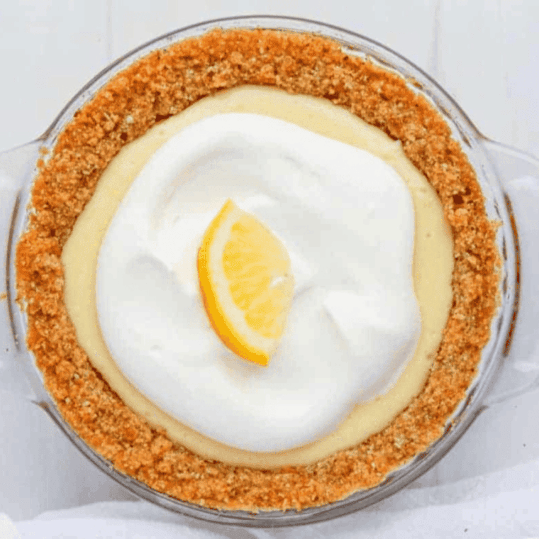 Air fryer lemon pie with golden crust and creamy lemon filling, sliced and ready to serve.