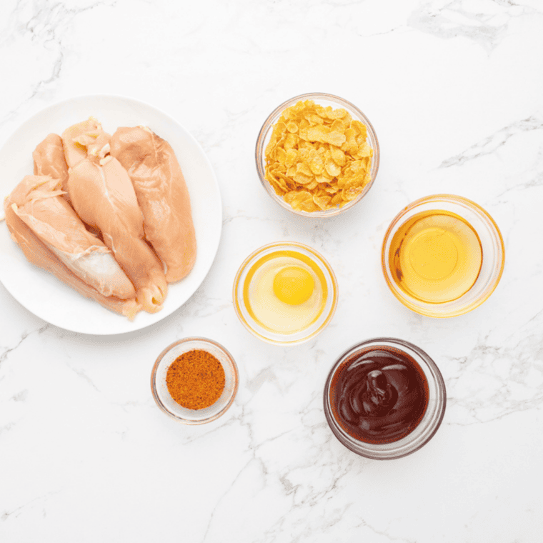 Ingredients needed for Air Fryer Pickle Brined Chicken Tenders on kitchen table.