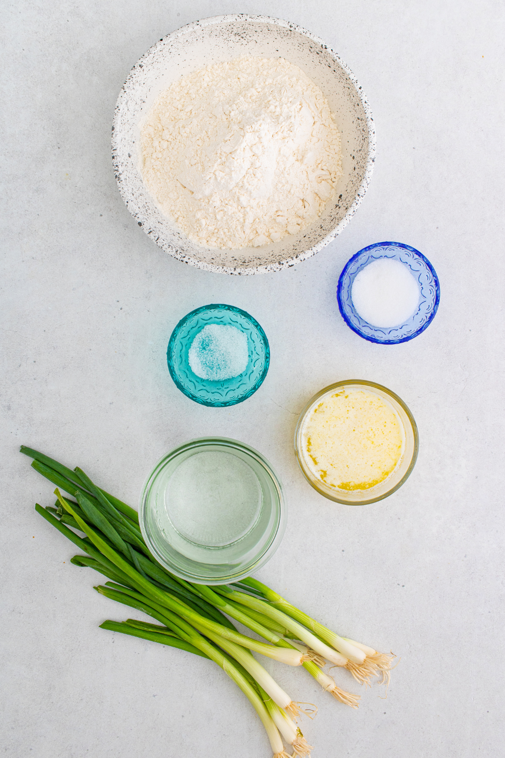 Ingredients needed for Air Fryer Scallion Pancakes on kitchen table.