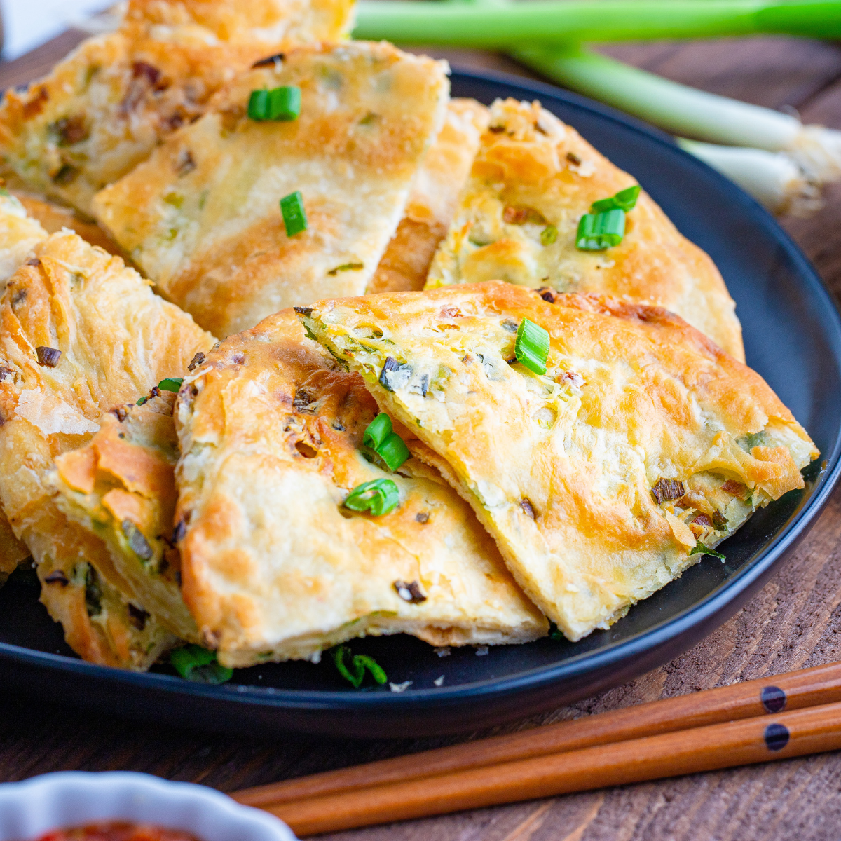 Crispy air fryer scallion pancakes with flaky layers and green onions