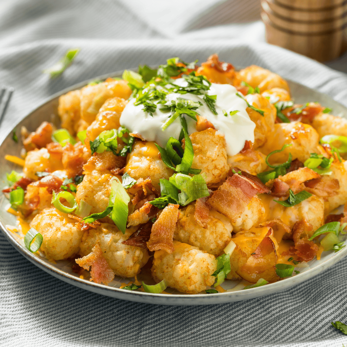 Crispy Buffalo Wild Wings Tater Tots topped with spicy buffalo sauce and creamy ranch dressing.