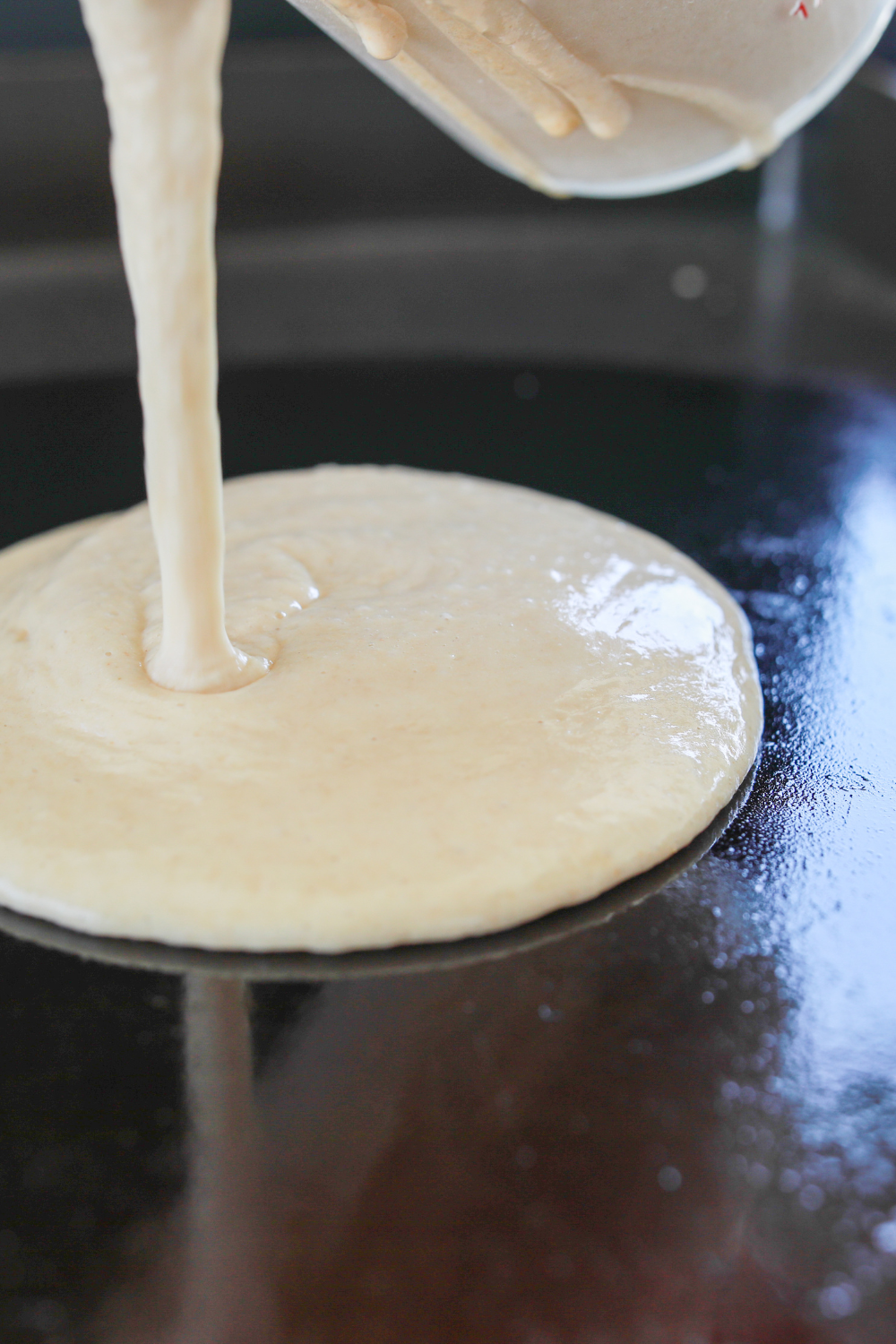 Six rounds of batter on the griddle, just poured.