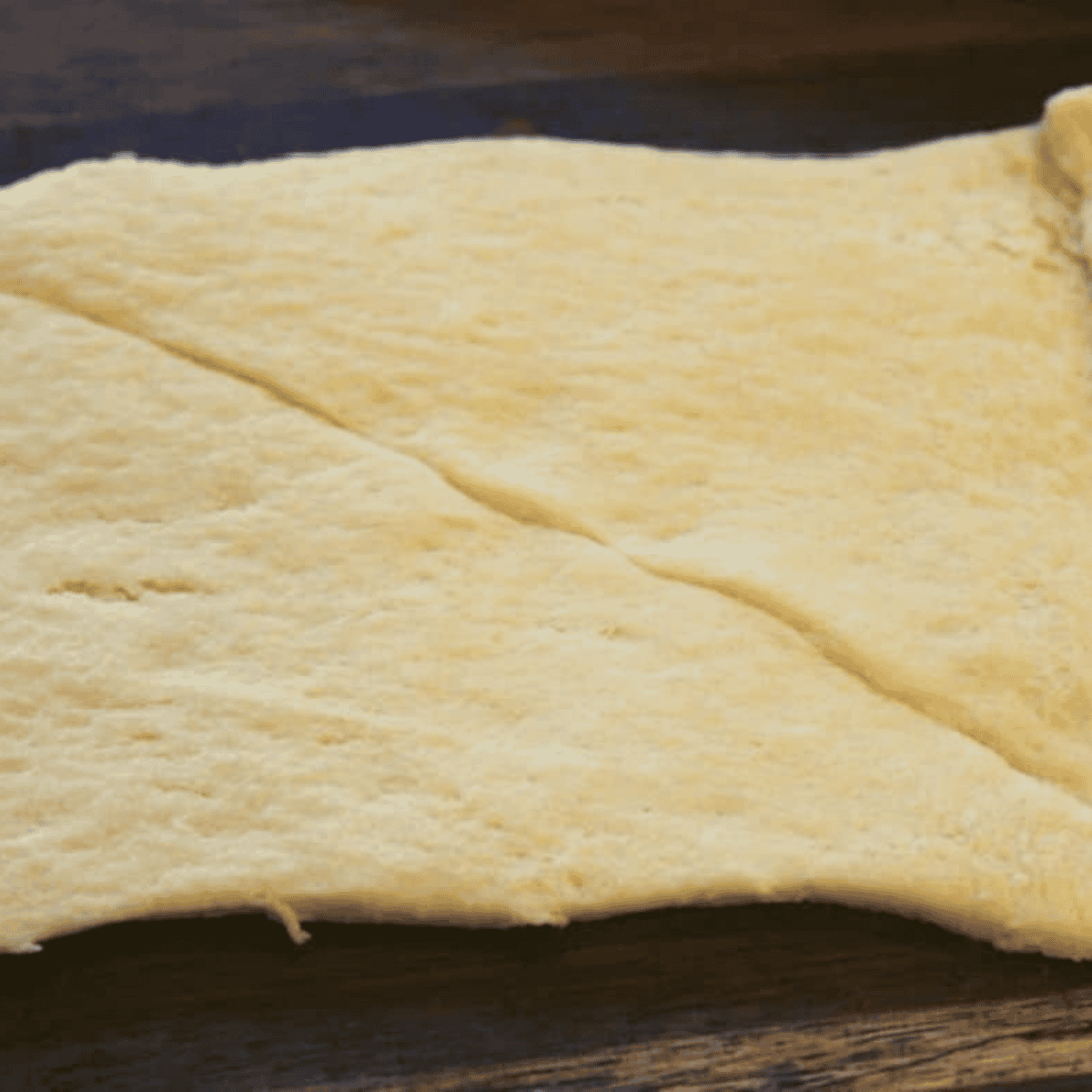 Lay out the crescent dough on a flat surface.