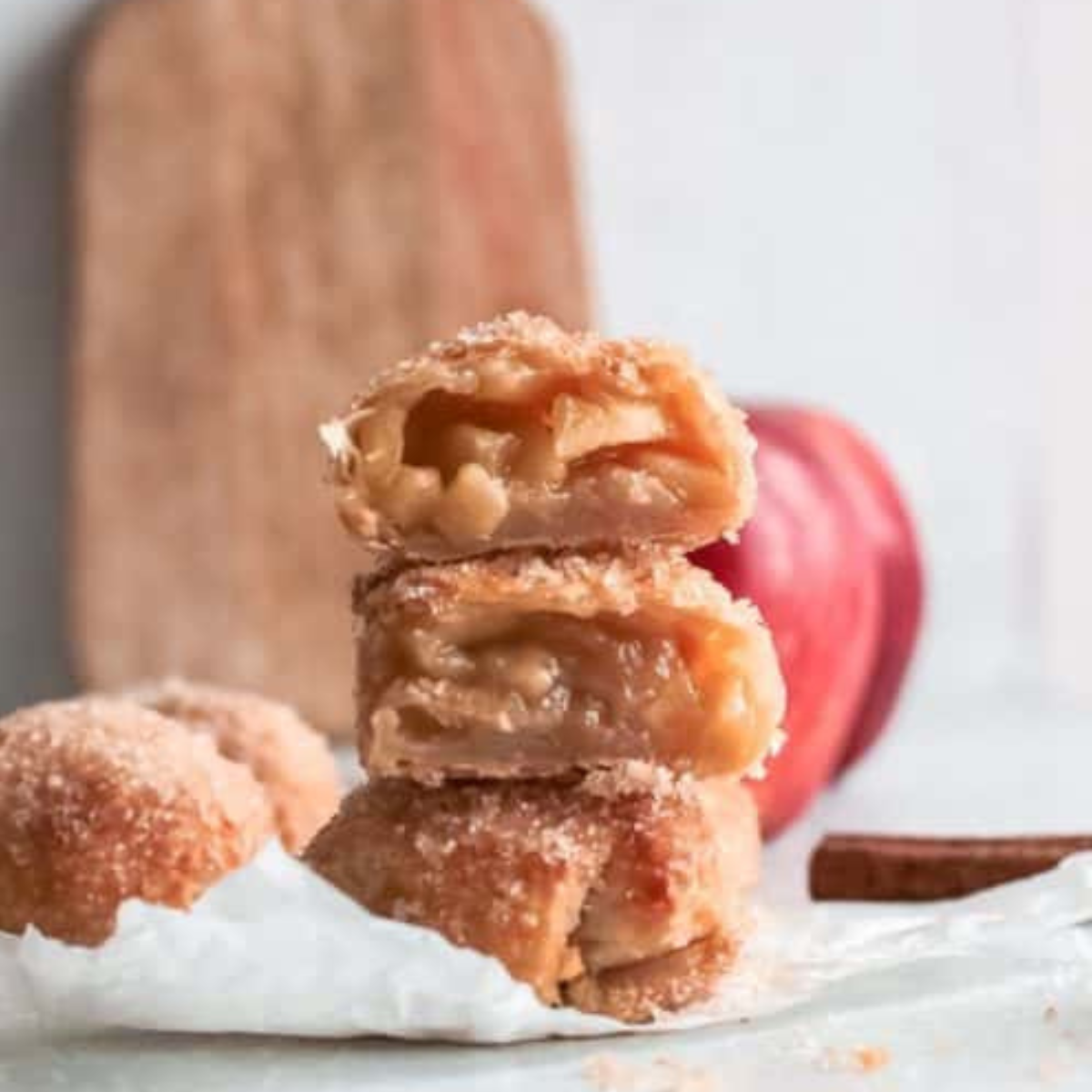 Golden air fryer apple pie bombs coated in cinnamon sugar
