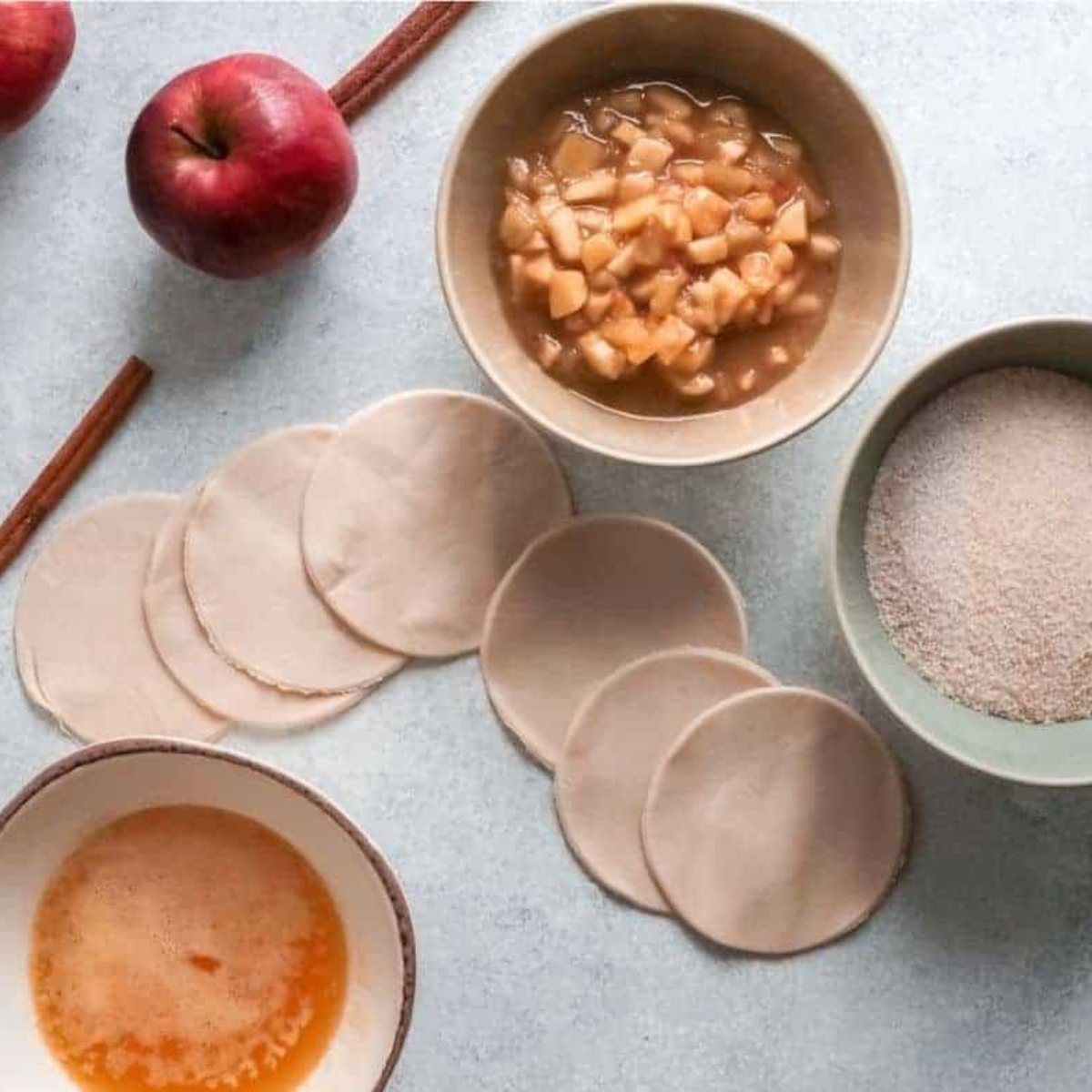 Ingredients for air fryer apple pie bombs on a kitchen table