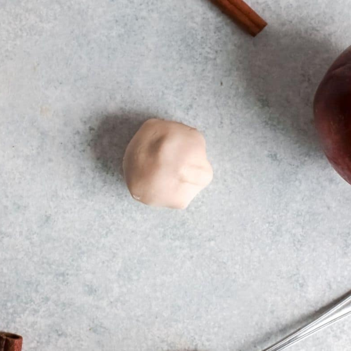 Rolling apple pie bomb dough into smooth balls before air frying
