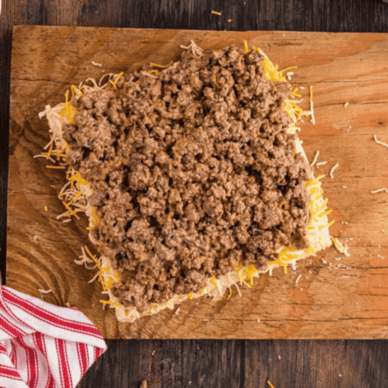 Slice Hawaiian rolls in half, set tops aside, and place bottom halves in the air fryer basket on foil.