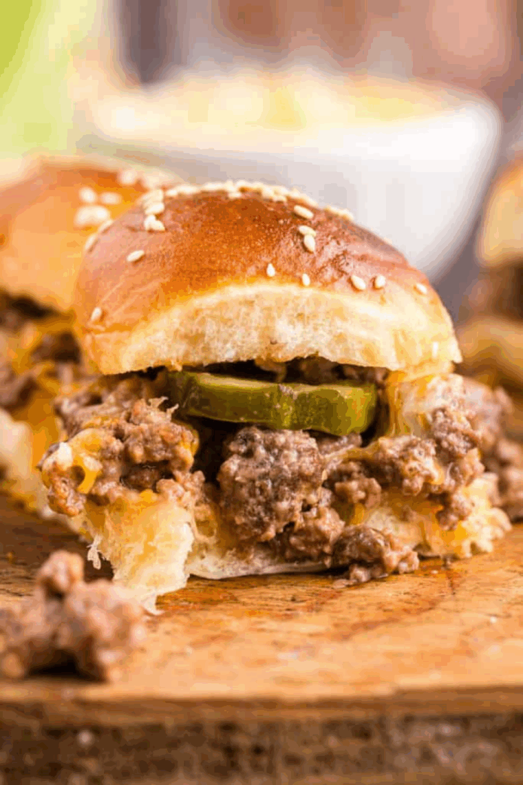 Air fryer loose meat sandwiches with melted cheese on soft rolls, golden and ready to serve.