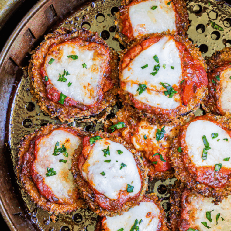 Cheesecake Factory eggplant parmesan with crispy breaded slices, marinara sauce, and melted mozzarella cheese
