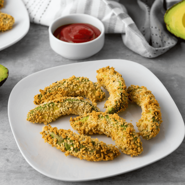 crispy gluten-free air fryer avocado fries served on plate with dipping sauce