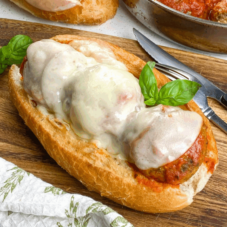 Instant Pot meatball sub sandwich with juicy meatballs, marinara sauce, and melted cheese on a hoagie roll.