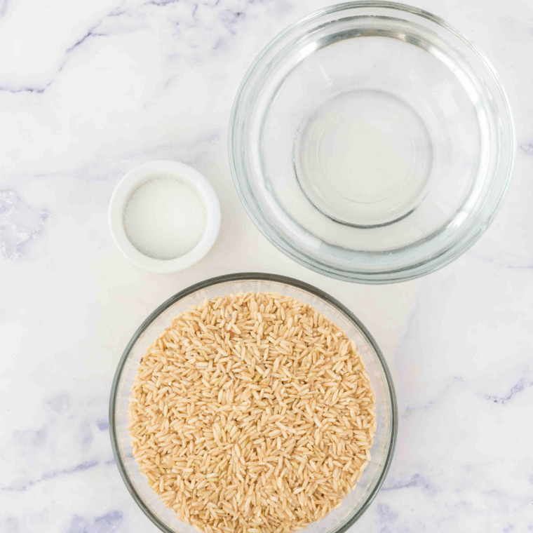 Ingredients needed for Instant Pot Garlic Brown Rice on kitchen table.