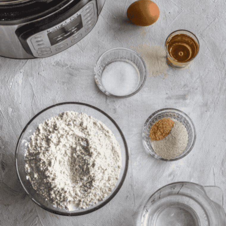 Ingredients needed for Sister Schubert's Parker House rolls on kitchen table.