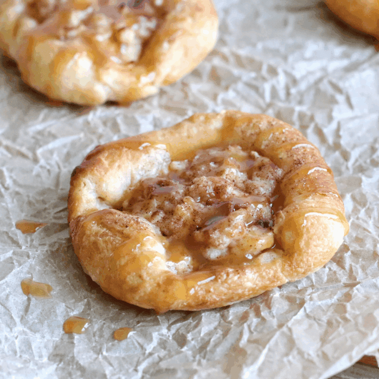 Golden, flaky apple Danish fresh from the air fryer, topped with glaze.