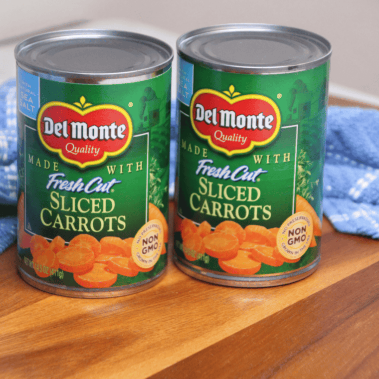 Ingredients needed for Easy Air Fryer Canned Carrots on kitchen table.