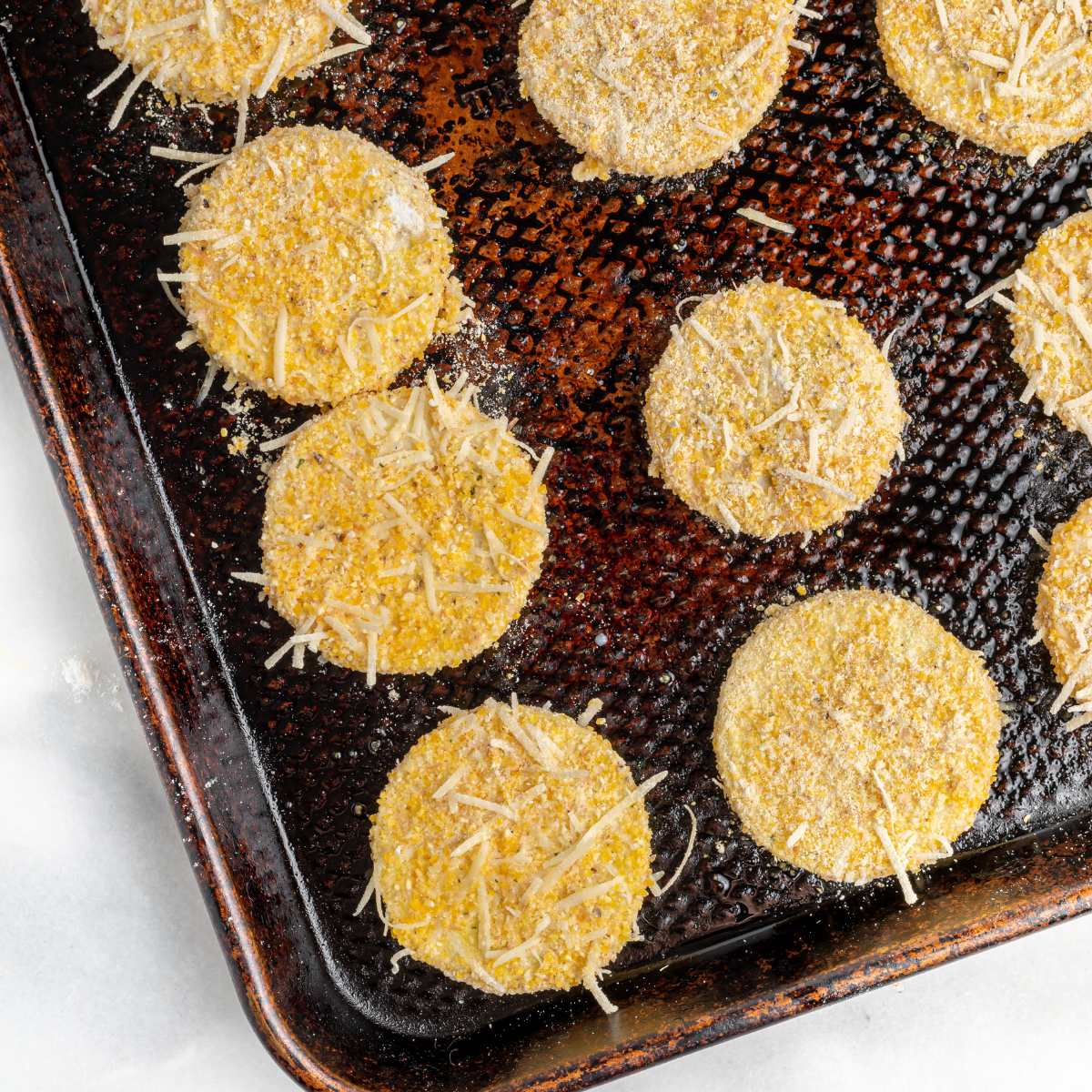 Air fryer fried squash after cooking, golden and crisp in the basket