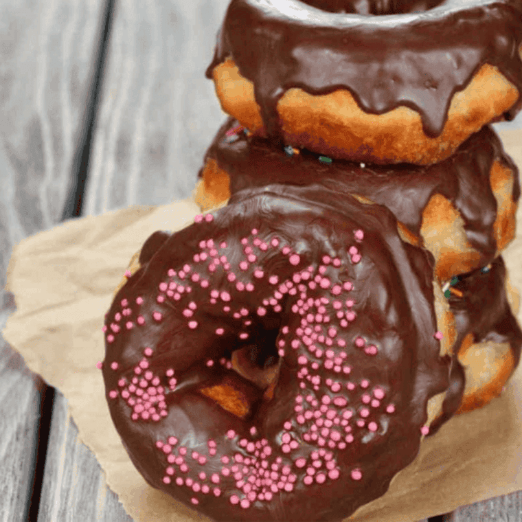 Golden Air Fryer Nutella Donuts dusted with powdered sugar, filled with creamy Nutella.