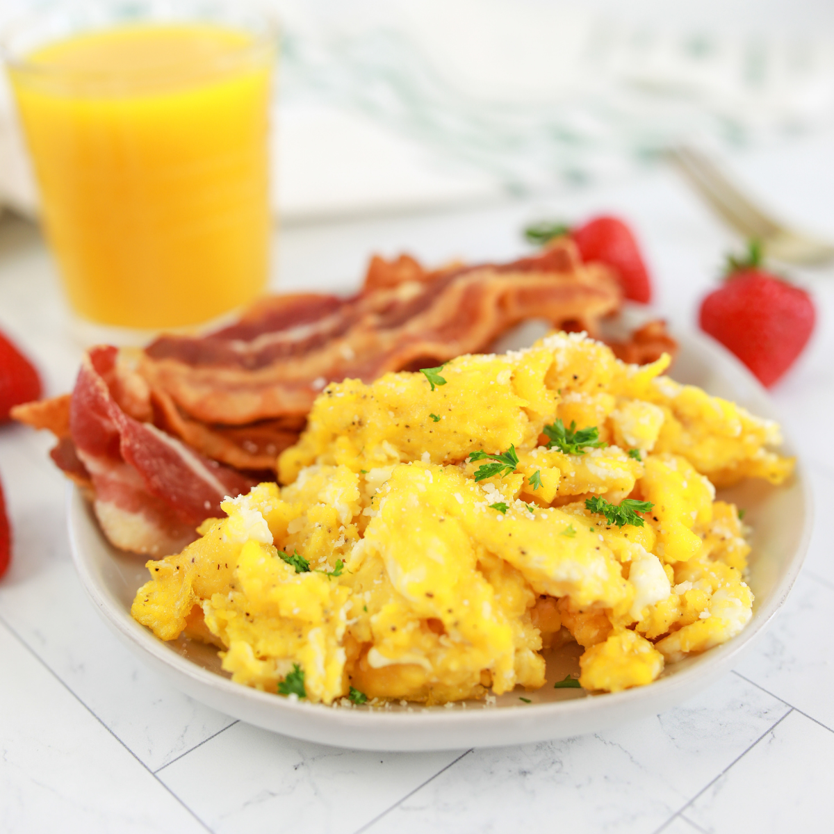 soft fluffy air fryer scrambled eggs cooked in small dish