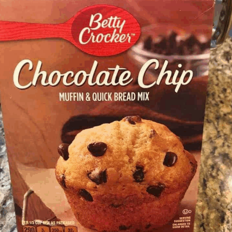 Ingredients needed for Air Fryer Betty Crocker Chocolate Chip Muffins on kitchen table.