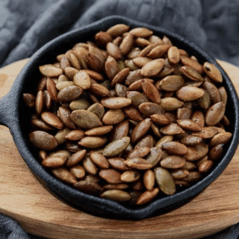Crispy seasoned roasted pepitas made in the air fryer for a quick and healthy snack.