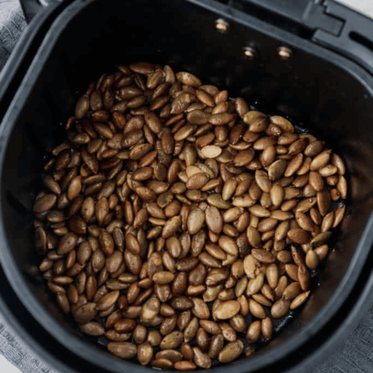 Air fryer roasted pepitas, golden, crunchy, and ready to eat.