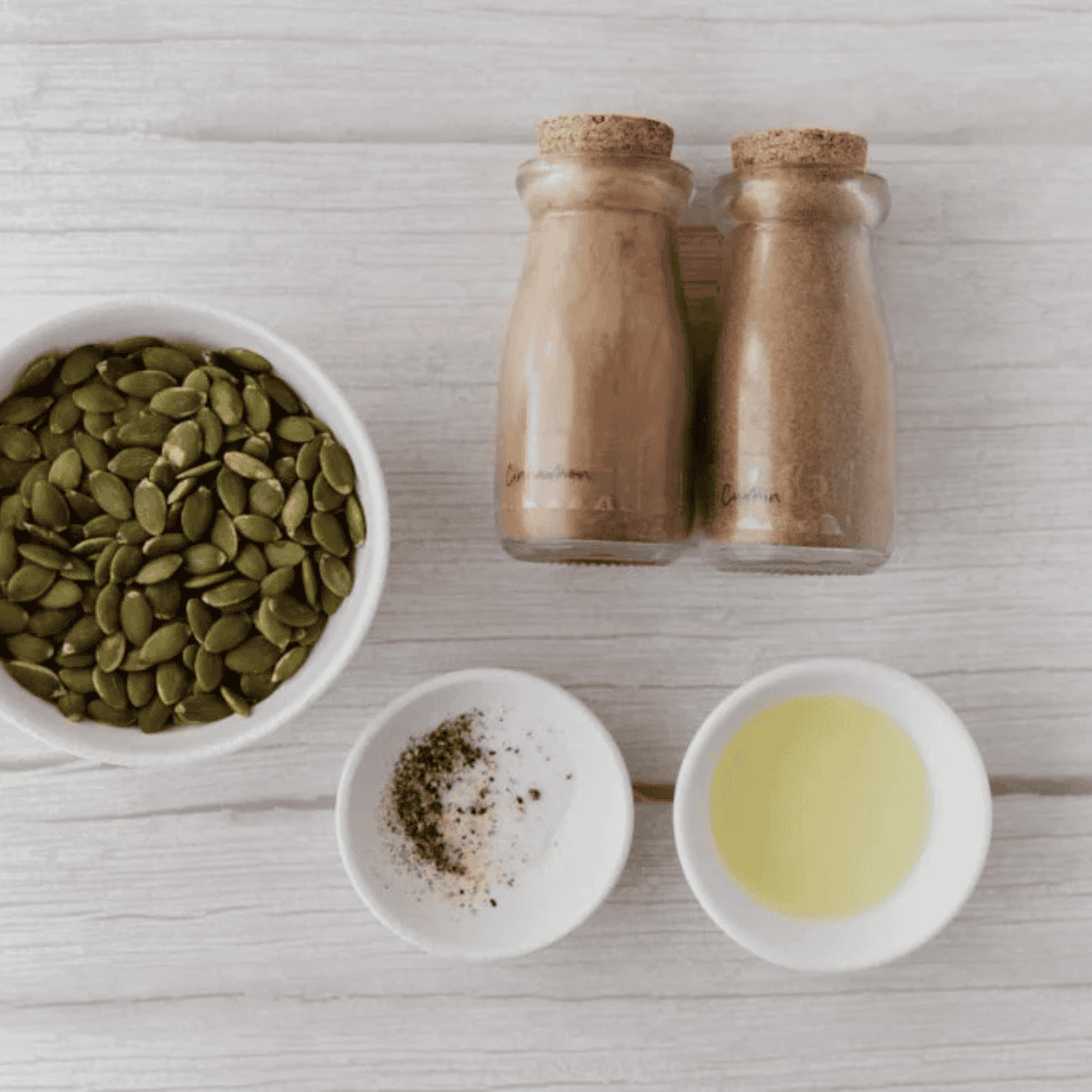 Ingredients needed for Easy Air Fryer Roasted Pepitas on kitchen table.