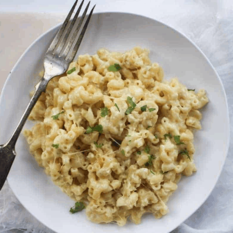 Plate of Chili’s White Cheddar Mac and Cheese Recipe on kitchen table.
