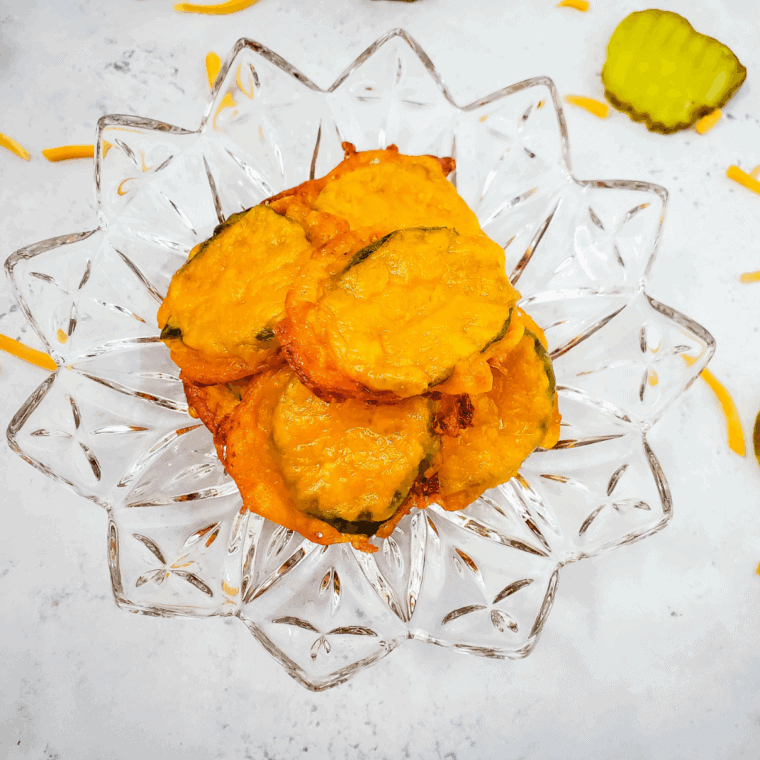 Golden, crispy air fryer cheese pickles fresh from the basket, ready to serve.