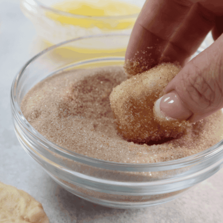 Marshmallow dipped in melted butter and coated with cinnamon-sugar mixture