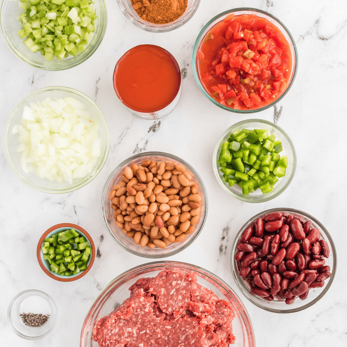 Ingredients for Instant Pot Copycat Skyline Cincinnati Chili: ground beef, tomato sauce, onion, garlic, and spices.