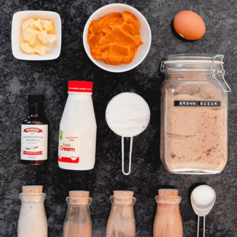 Ingredients for Instant Pot pumpkin pie: canned pumpkin purée, evaporated milk, eggs, brown sugar, graham crackers, and pumpkin pie spice