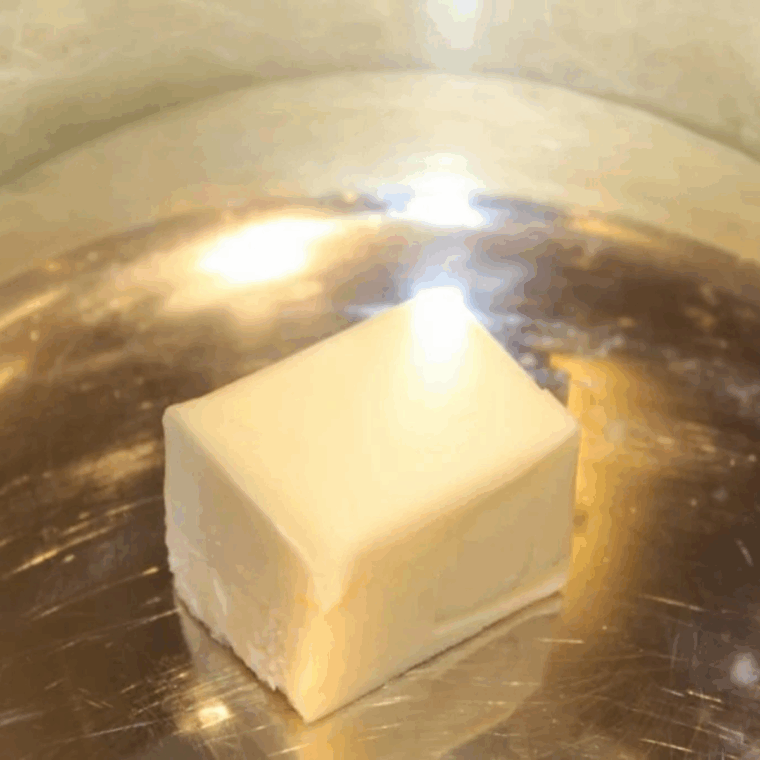 Butter melting in the Instant Pot bowl while being stirred on sauté mode
