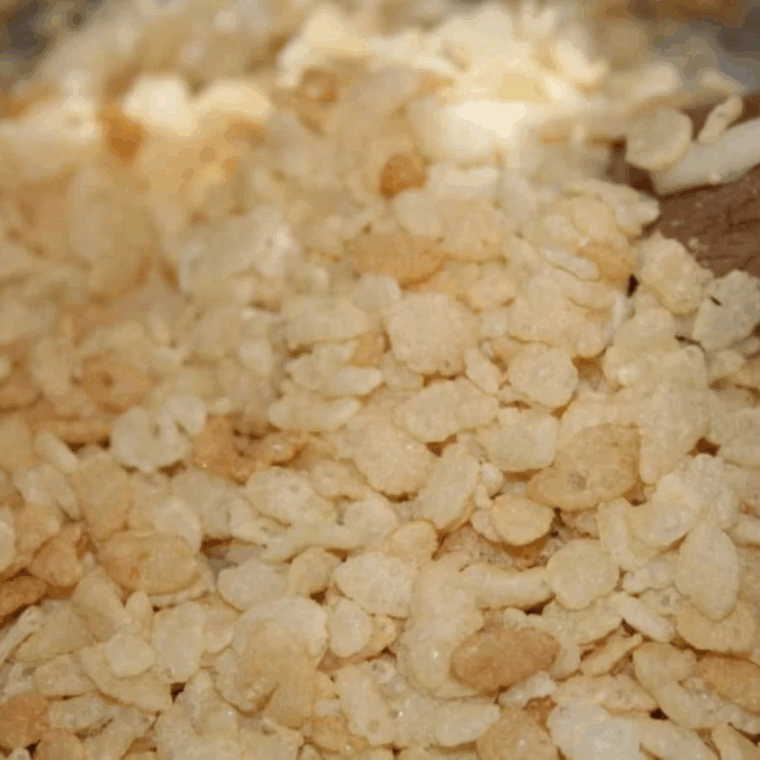 Marshmallows melting in the Instant Pot with butter, stirred to a smooth mixture