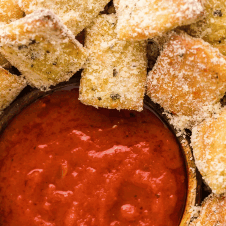 A rich, red homemade spaghetti sauce simmering in a pot, with visible pieces of tomato and herbs, replicating the smooth texture of Prego sauce.