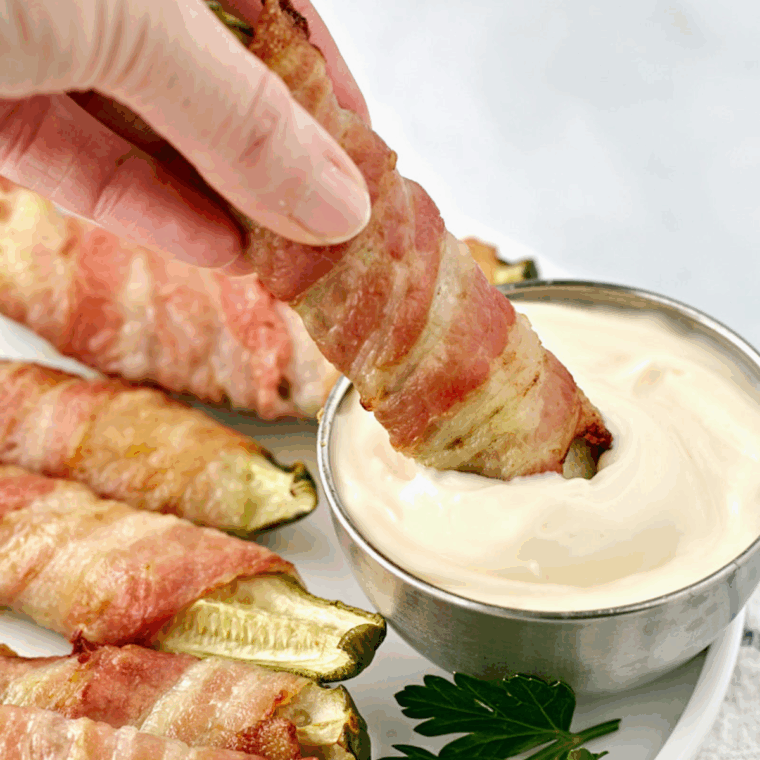 Air fryer bacon wrapped pickles cooked until crispy and golden brown