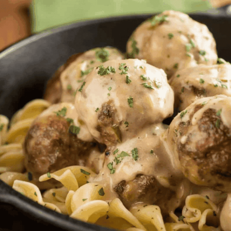 Instant Pot frozen meatballs served over creamy egg noodles