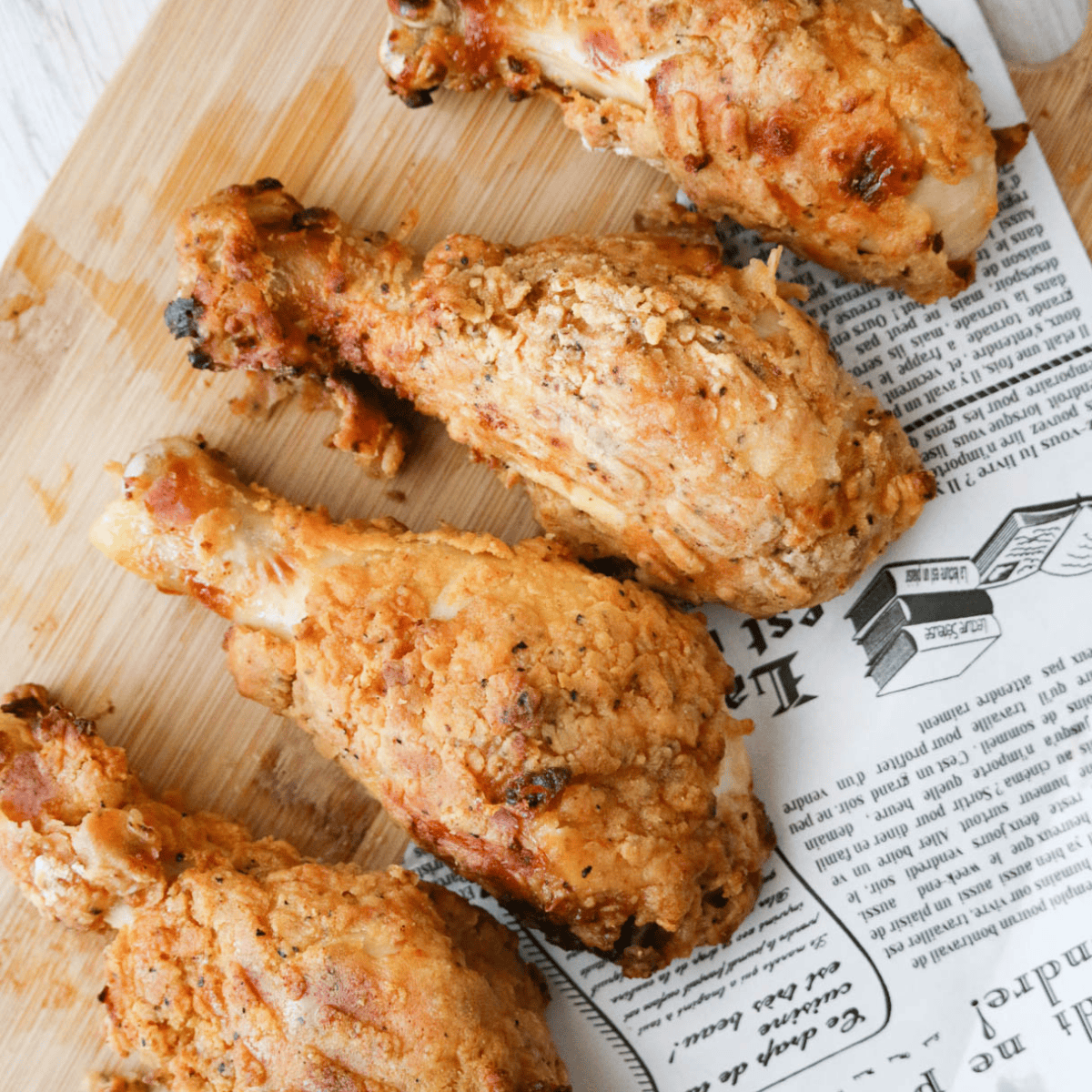 Crispy golden Pioneer Woman Chicken Fried Chicken served with creamy country gravy on a plate.