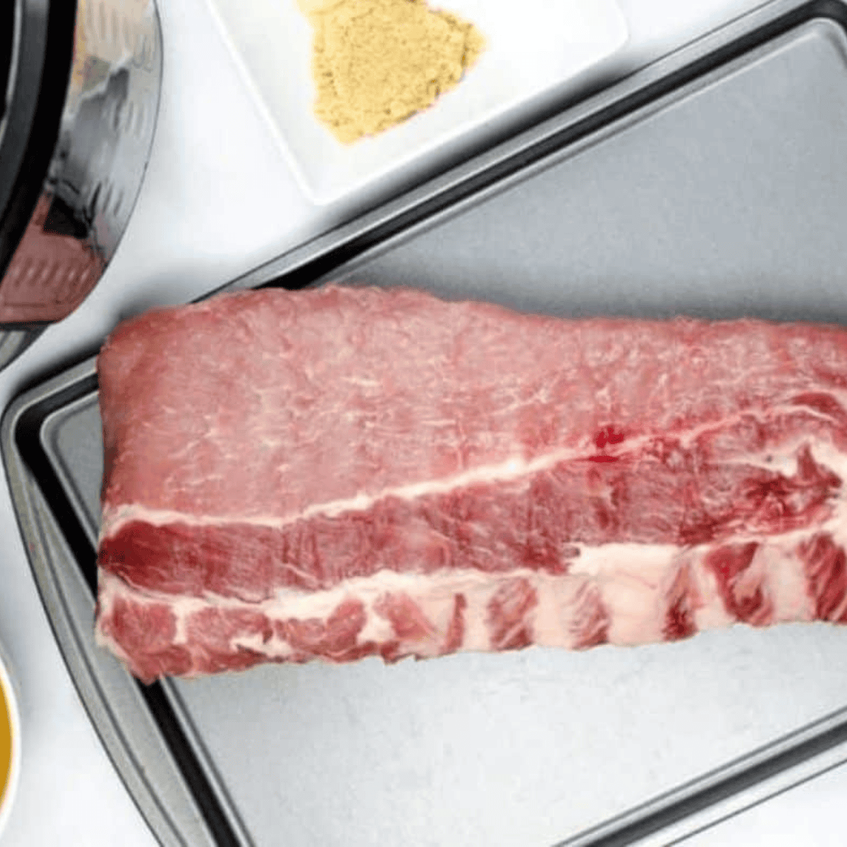 Ingredients needed for Easy Tony Roma Baby Back Ribs Recipe on kitchen table.