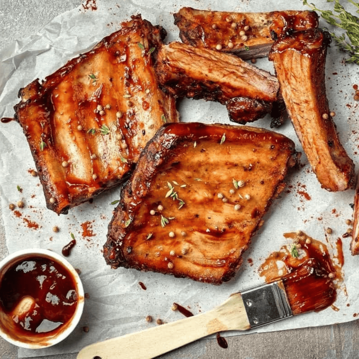 Delicious Tony Roma's Baby Back Ribs copycat, coated in sweet and tangy BBQ sauce, served with coleslaw and fries.