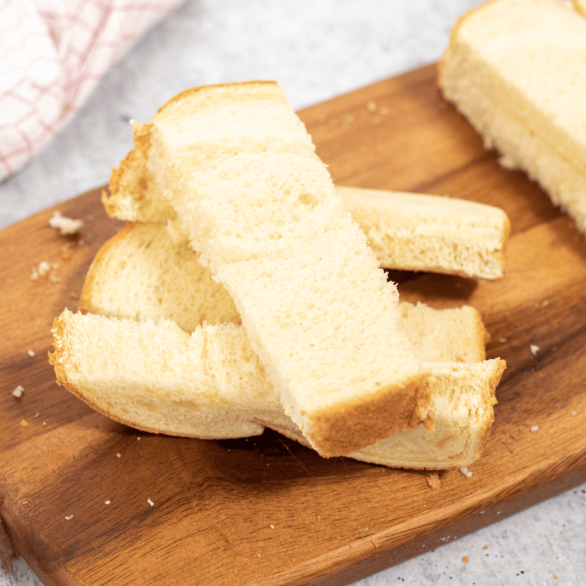 Ingredients needed for How to Make Light and Fluffy Air Fryer French Toast Sticks (Soft Inside, Just-Crisp Outside) on kitchen table.