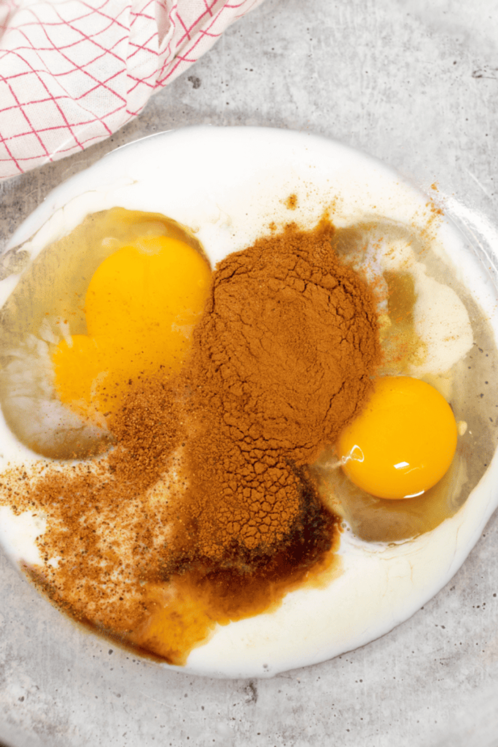Custard mixture whisked smooth in shallow mixing bowl