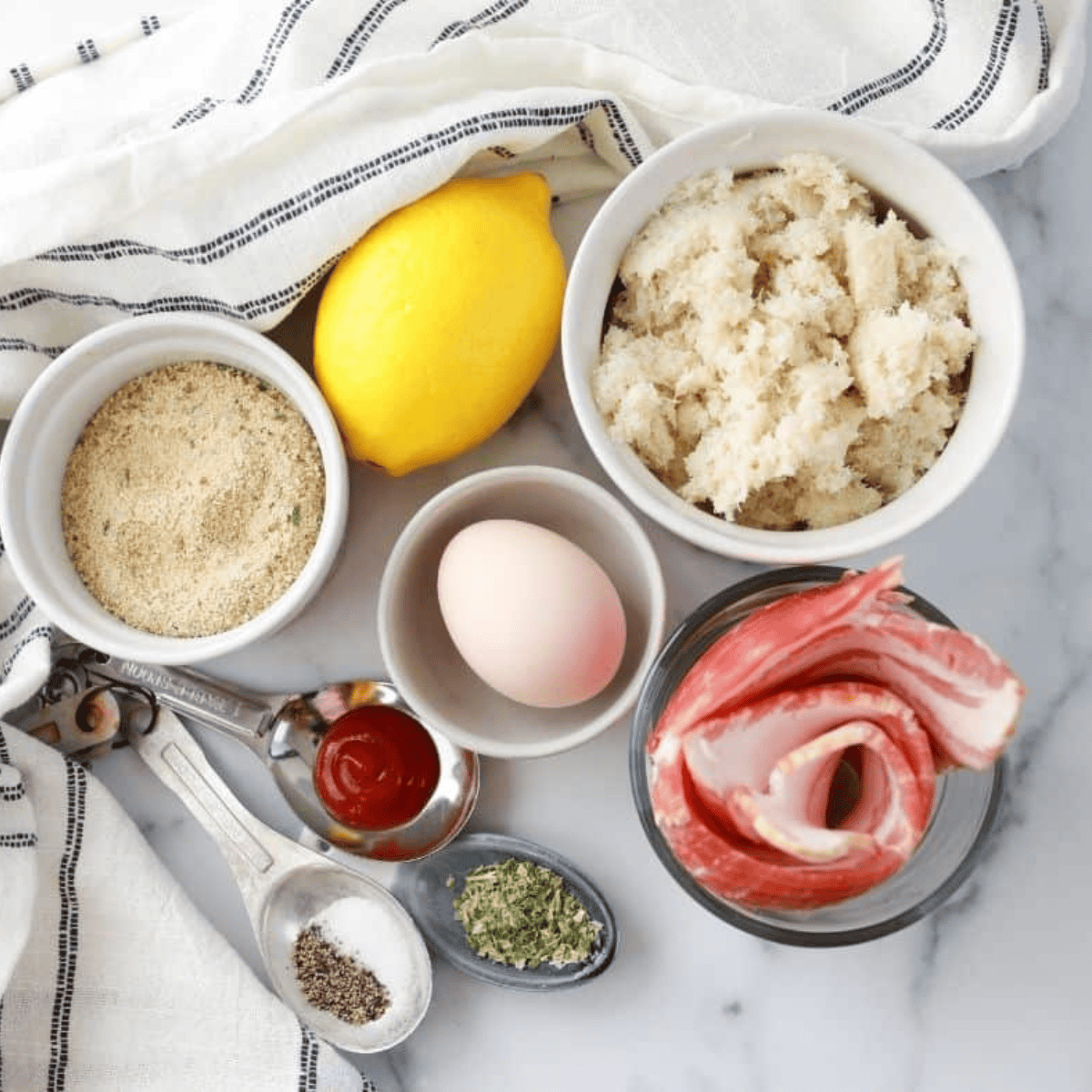 Ingredients needed for Air Fryer Bacon and Crab Rolls on kitchen table.