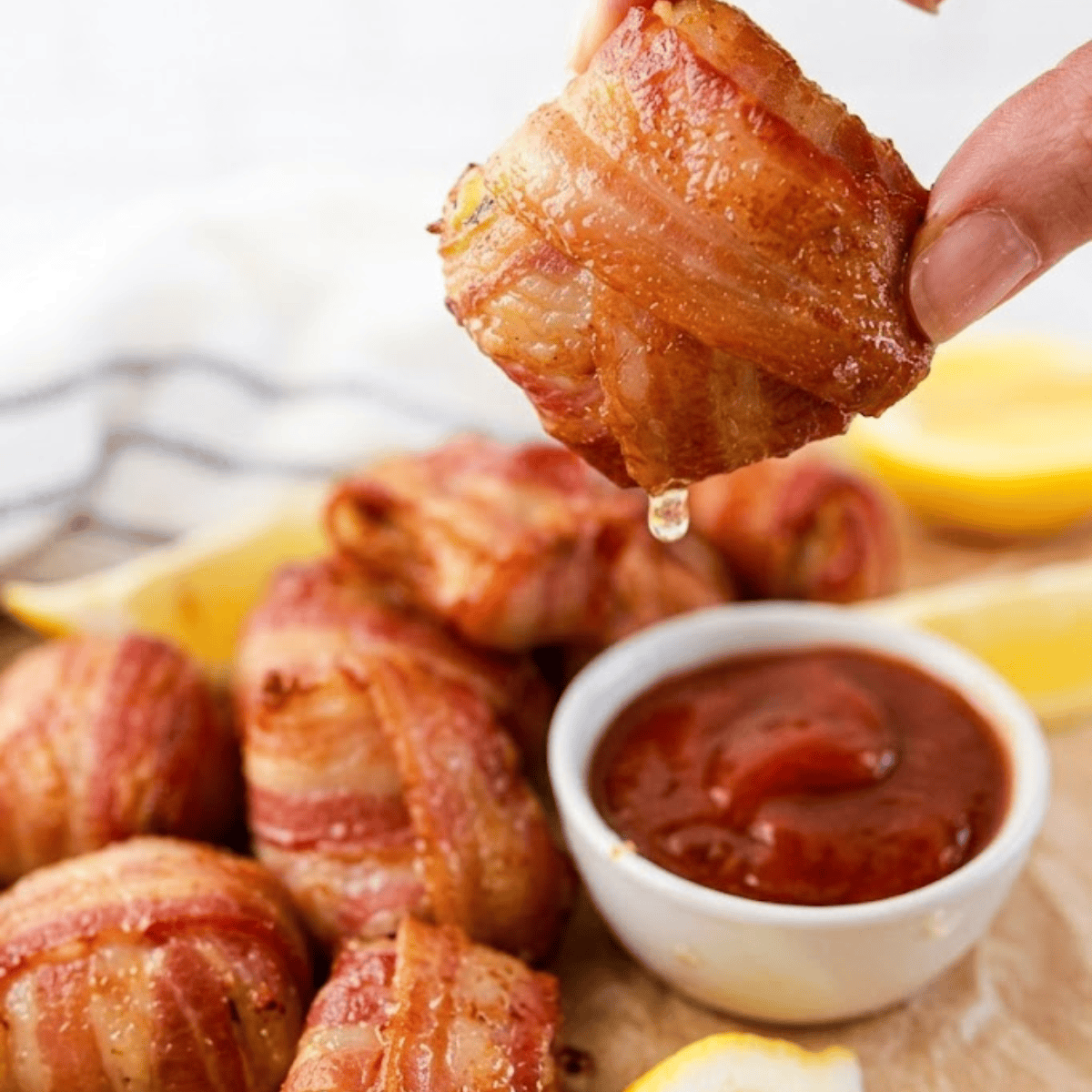 Crispy air fryer bacon-wrapped crab rolls with savory filling served on a plate.
