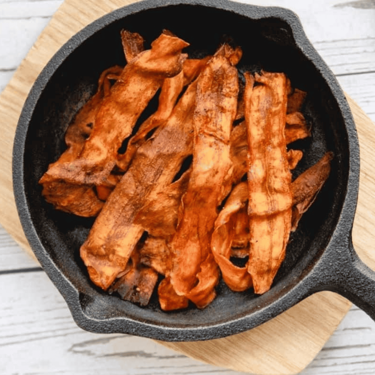 Air fryer carrot bacon piled on toast with egg for brunch