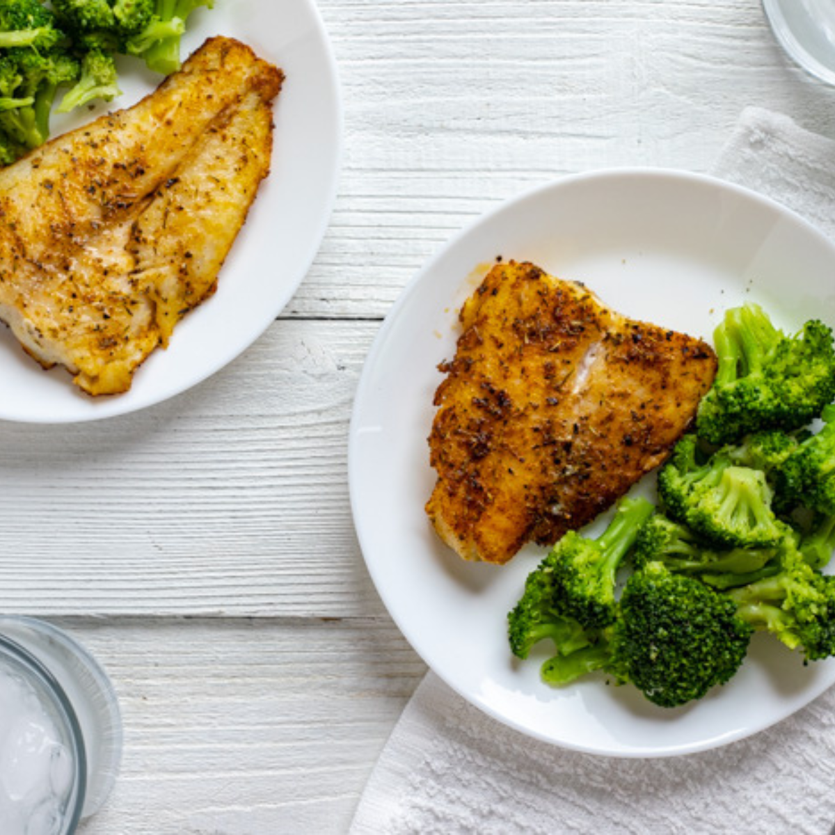 air fryer chilean sea bass with lemon garlic butter flaky fish on plate