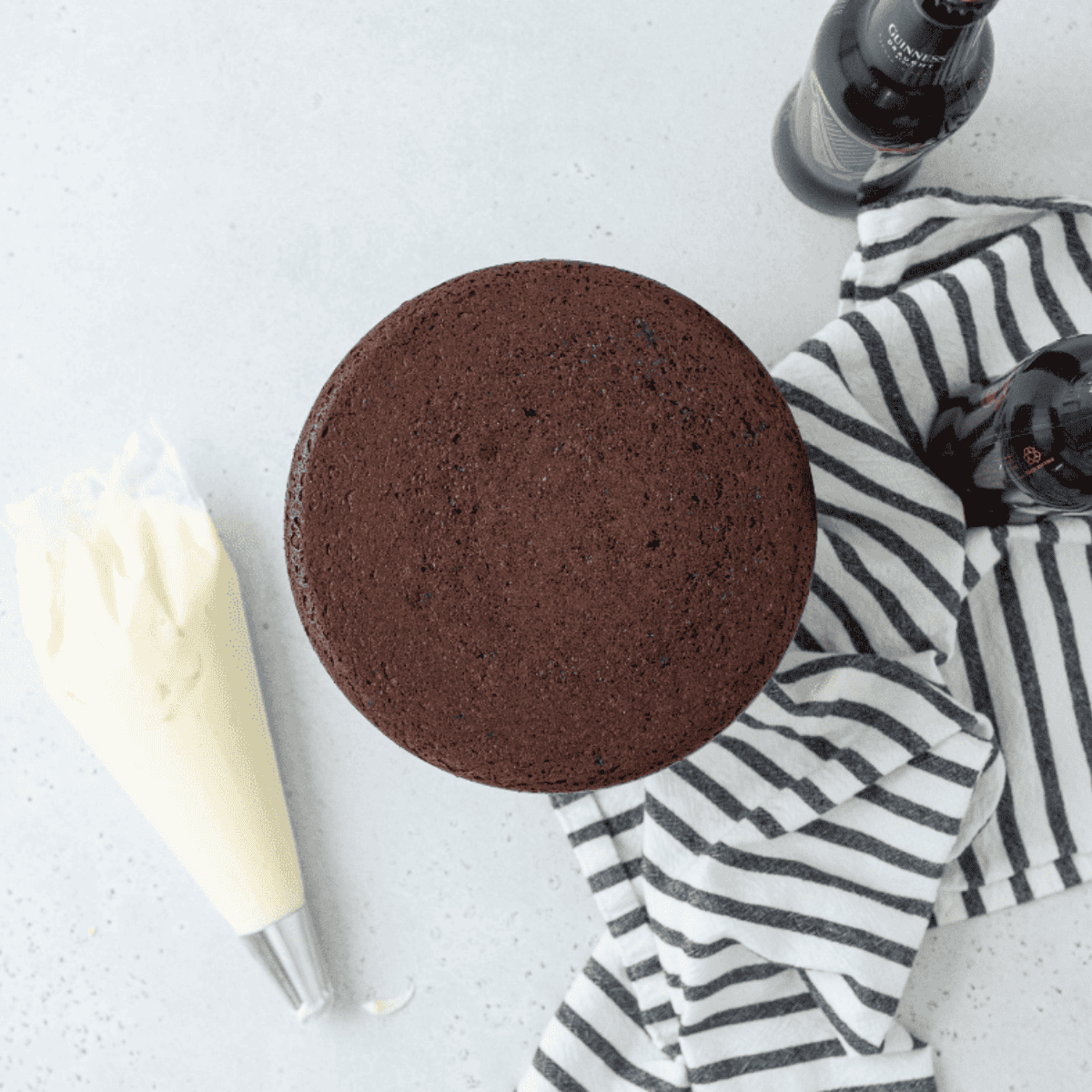 Freshly baked Air Fryer Flourless Chocolate Cake cooling in the pan on a wire rack.